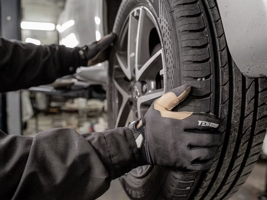 Independent garage mechanic working on a customer's car