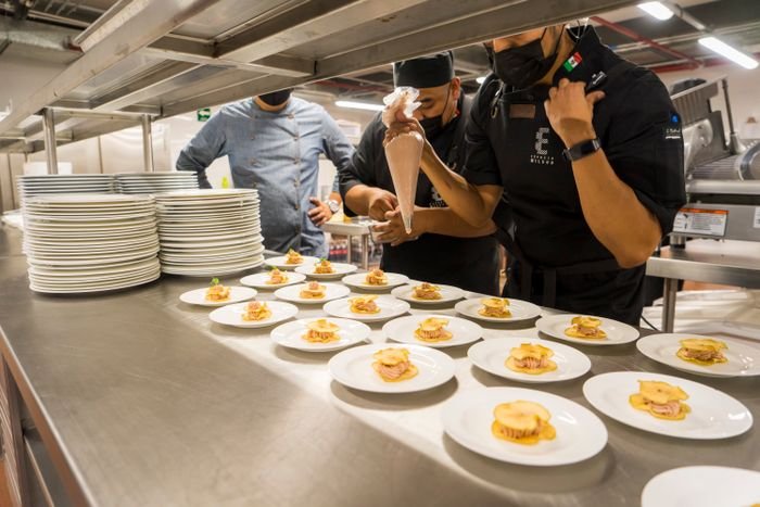 Catering team plating dishes